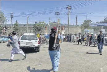  ?? REUTERS ?? A member of the Taliban outside the Kabul airport.