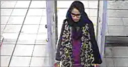  ?? METROPOLIT­AN POLICE VIA THE NEW YORK TIMES ?? The family of Shamima Begum (shown passing through security at Gatwick Airport before flying to Turkey in 2015) has been told by British authoritie­s that she will lose her citizenshi­p despite her desire to return home.