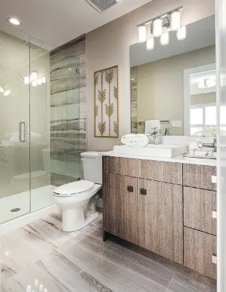  ??  ?? The ensuite in the Hillcrest show home at Nolan Park is finished with upscale details, such as a wide shower door.