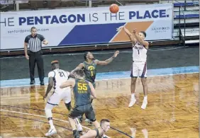  ?? Josh Jurgens / Associated Press ?? Gonzaga guard Jalen Suggs shoots a 3-pointer during the first half Saturday against Iowa. He made 7 of 10 attempts from long range.