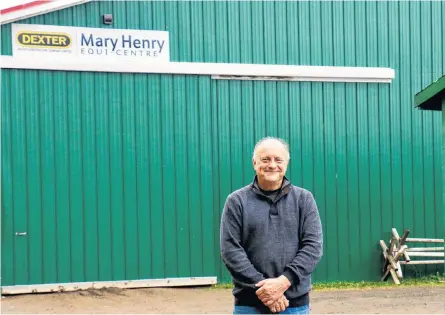 ?? CAROLE MORRIS-UNDERHILL ?? Andy Woolaver stands in front of the Mary Henry Equi-Centre at the Hants County Exhibition Grounds in Windsor. Woolaver moved to the area about 25 years ago as his horse-riding daughters were being taught by Henry.