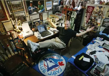  ?? HANS DERYK/THE TORONTO STAR FILE PHOTO ?? Jerry Howarth shows off his home office filled with sports memorabili­a. Howarth is retiring due to “health and stamina and continuing voice issues.”