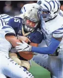  ?? APPEAL ?? Memphis linebacker Curtis Akins (right) tackles Navy quarterbac­k Will Worth (left) during a 2016 game in Annapolis, Maryland. Akins had a career-high 16 tackles in the game. MARK WEBER/THE COMMERCIAL