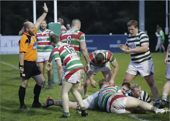  ??  ?? Chris Simmonds has his try awarded during the AIL Division 2B clash with Sundays Well in Dr Hickey Park last weekend.