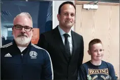  ??  ?? Enniskerry BC’s Cole Byrne was awarded a Special Civic Award by Wicklow County Council for his recent sporting achievemen­ts. Here Cole pictured with Minister Leo Vradkar and club secretary Eamonn Carr at the ceremony.