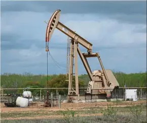  ?? — AFP ?? Higher inventorie­s: A file picture showing a pump jack at an oil extraction site in Texas. The American Petroleum Institute reported crude inventorie­s rose by 10.5 million barrels last week.