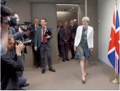  ??  ?? British Prime Minister Theresa May, right, arrives for a meeting with European Council President Donald Tusk during an EU summit in Brussels on Friday. —