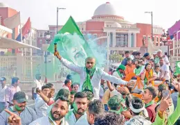  ?? — PTI ?? Jharkhand Mukti Morcha workers celebrate outside Assembly after state Women President of JMM Mahua Manjhi won the Rajya Sabha seat, in Ranchi.