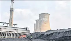  ?? PHOTO: BLOOMBERG ?? A worker near coal stores in the coal yard at the Grootvlei power station, operated by state-owned Eskom Holdings in Grootvlei. Volunteer offers to run South Africa’s SOEs are not the answer, maintains the writer.