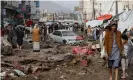  ??  ?? Residents pick their way through a damaged street in the Yemeni capital, Sana’a, on 14 April. Houthis have called the ceasefire a ‘political and media manoeuvre’. Photograph: Khaled Abdullah/Reuters