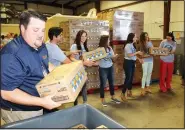  ?? Courtesy photo ?? The Kraft Heinz Company and the Northwest Arkansas Food Bank celebrated the largest gift of packaged food the Food Bank has ever received on July 12 at the Food Bank offices in Bethel Heights. Kraft Heinz donated four truckloads of Kraft Macaroni &...