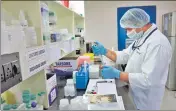  ?? REUTERS ?? A scientist works on a testing kit for the coronaviru­s disease (Covid-19) in a Kolkata laboratory.