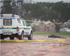  ??  ?? The body of a man alleged to be the attacker who killed two worshipper­s in a mosque, lying dead in a field after being shot by police. — AFP photo