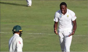  ?? Picture: MIKE HUTCHINGS, REUTERS ?? THE KG GEAR: A pumped-up Kagiso Rabada celebrates the wicket of Usman Khawaja in Port Elizabeth yesterday.