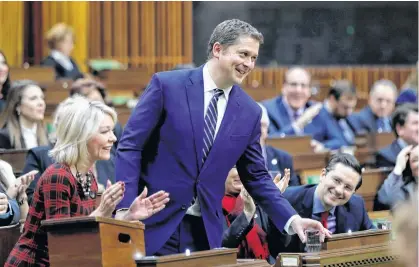  ?? BLAIR GABLE • REUTERS ?? Andrew Scheer announces that he is stepping down as Conservati­ve party leader in the House of Commons on Parliament Hill on Thursday.