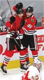  ?? GETTY IMAGES ?? Pius Suter (left) and Patrick Kane celebrate Suter’s first NHL goal on Jan. 24 against the Red Wings at the United Center.