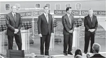  ?? JUSTIN SULLIVAN, GETTY IMAGES ?? Republican presidenti­al candidates, from left, George Pataki, Rick Santorum, Bobby Jindal and Lindsey Graham were the only ones on stage, but Donald Trump cast a long shadow.