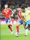  ?? ?? Brazil’s Vinicius Jr, (right), runs with the ball during a friendly soccer match between Spain and Brazil at the Santiago Bernabeu stadium in Madrid, Spain. (AP)