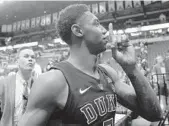  ?? MICHAEL REAVES/GETTY IMAGES ?? Duke’s RJ Barrett shushes the rowdy FSU crowd Saturday after the Blue Devils escaped with an 80-78 victory.