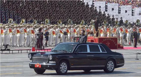  ??  ?? This file photo shows China’s President Xi Jinping beginning a review of troops from a Chinese-made Hongqi Red Flag limousine during a military parade marking the 70th anniversar­y of Japan’s defeat in World War II, at Tiananmen Square in Beijing. — AFP photo