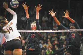  ?? Joshua A. Bickel / Columbus Dispatch 2016 ?? Stanford’s Merete Lutz (17) rises for a block with teammate Inky Ajanaku (12) on a shot from Texas’ Paulina Prieto-Cerame (19) during the NCAA title game in December in Columbus, Ohio.