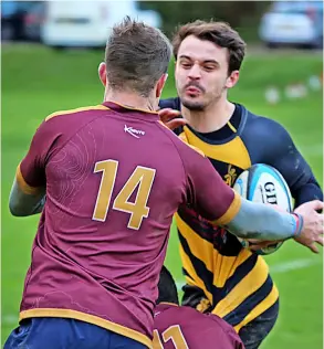  ?? ?? Avon RFC’S Matt Thresher on his way to a hat-trick of tries during their comprehens­ive 50-5 win over Tor