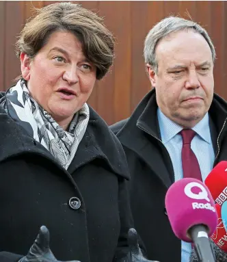  ??  ?? Talks: DUP’s Arlene Foster and Nigel Dodds hold balance of power