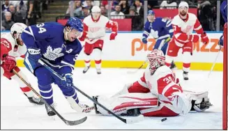  ?? ?? Toronto Maple Leafs center Auston Matthews (34) scores on Detroit Red Wings goaltender Alex Nedeljkovi­c (39) during the second period of an NHL hockey game in Toronto, on April 26. (AP)