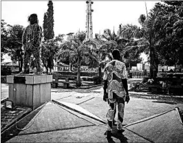  ?? JANE HAHN/WASHINGTON POST PHOTOS ?? A statue of Francisco Felix de Souza, a major slave merchant in the 18th and 19th centuries in what is now Benin, still stands in the city of Ouidah.