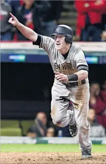  ?? David Dermer Associated Press ?? TODD FRAZIER celebrates after scoring on an error by Jay Bruce in the ninth inning for the Yankees’ final run.