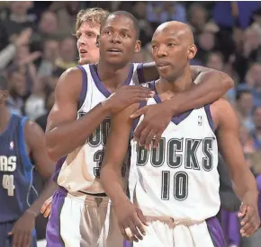  ?? JOURNAL SENTINEL FILES ?? Ray Allen embraces teammate Sam Cassell (right) after the Milwaukee Bucks defeated the Dallas Mavericks in 2003. In his new memoir "From the Outside," Allen dishes on his years with the Bucks, including his conflict with coach George Karl.