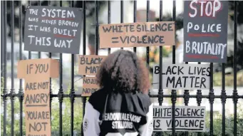  ?? ARMAND HOUGH ?? BLACK Lives Matter supporters gathered outside Parliament yesterday in solidarity with those protesting against the deaths of George Floyd in the US and Collins Khosa, who was killed by the SANDF during lockdown. | African News Agency (ANA)