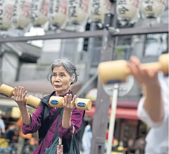  ?? ?? Women
work out with dumbbells
during an event
marking Respect For
The Aged Day in 2016 in Tokyo,
Japan
Picture
Franck Robichon