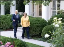  ??  ?? Angela Merkel and Joe Biden at the White House yesterday