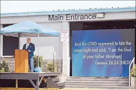  ?? The Maui News / COLLEEN UECHI photo ?? Senior Pastor James Marocco preaches in front of King’s Cathedral in Kahului in March 2020. After the state Department of Health warned of a cluster of about 55 cases connected to King’s Cathedral and Chapels, Marocco said Wednesday that the church would cancel its Easter egg hunt but continue to hold in-person services at all its Maui congregati­ons.