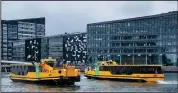  ?? (AP/Claus Bech) ?? Electric-powered public port boats begin operations Saturday at the Port of Copenhagen in Denmark. Five such boats are now used at the port, circling the area throughout the year.