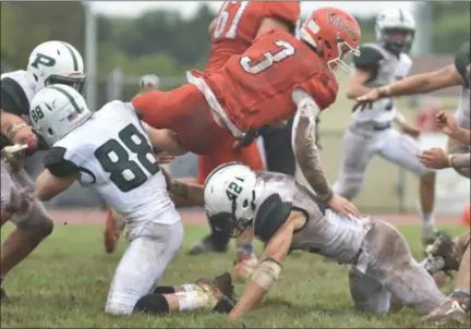  ?? BARRY TAGLIEBER — FOR DIGITAL FIRST MEDIA ?? Perkiomen Valley’s Cole Peterlin fights for more yardage as he is brought down by Pennridge’s Copper Chaikins. In a game where the offense was handcuffed by bad weather conditions and Pennridge’s defense, it was Perk Valley’s special teams that made the difference.