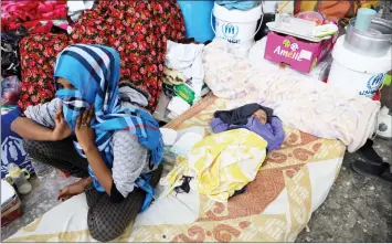  ??  ?? Migrants are seen at the Anti-Illegal Immigratio­n Agency in al-Nasr detention center in Zawiya, west of Tripoli. — Reuters photo