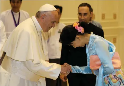  ?? Reuters ?? Pope Francis shakes hands with Myanmar’s State Counsellor Aung San Suu Kyi in Naypyitaw, Myanmar, on Tuesday. —