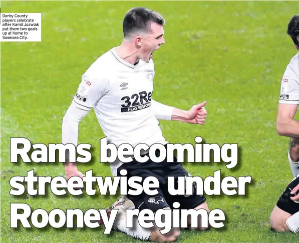  ??  ?? Derby County players celebrate after Kamil Jozwiak put them two goals up at home to Swansea City.