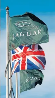  ?? /Reuters ?? Flagship vehicle: Flags fly outside the Jaguar assembly plant in Castle Bromwich, Birmingham, central England.