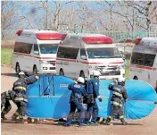  ?? AP ?? Firefighte­rs transfer a rescued person in Shari, in the northern island of Hokkaido, yesterday.