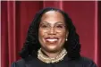  ?? The Associated Press ?? ■ Associate Justice Ketanji Brown Jackson stands as she and members of the Supreme Court pose for a new group portrait following her addition at the Supreme Court building in Washington on Friday.