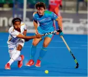  ??  ?? Dabang Mumbai’s Manpreet Singh (left) vies for the ball with a Uttar Pradesh Wizards defender in their HIL-5 match in Lucknow on Wednesday. The match ended 4-4.