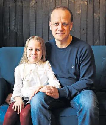  ??  ?? Proud: Tim Stollery and his visually impaired daughter Eleanor, who plays Tiny Tim in A Christmas Carol as she fights a tumour