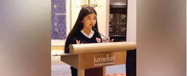  ??  ?? ↑
The 13-year-old author Himakshi Shastri believes proper communicat­ion can make the world a better place. Above, Shastri is seen delivering a climate change speech.