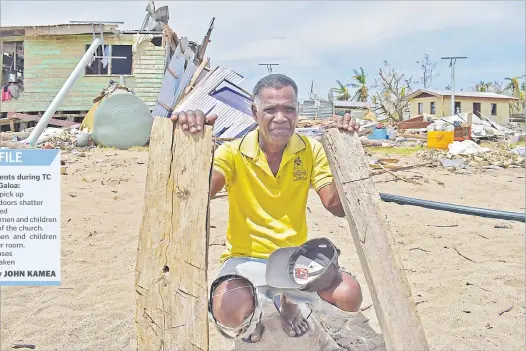  ?? Picture: JOVESA NAISUA ?? Above: Serupepeli Vela in between two posts, the only things left of his home after it was destroyed by STC Yasa on Galoa Island.