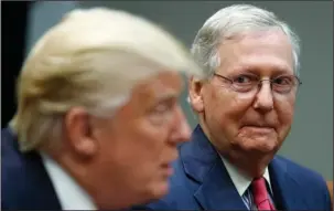  ?? The Associated Press ?? TRUMP AND MCCONNELL: In this Sept. 5 photo, Senate Majority Leader Mitch McConnell, R-Ky., right, listens as President Donald Trump speaks during a meeting with Congressio­nal leaders and administra­tion officials in the Roosevelt Room of the White House...
