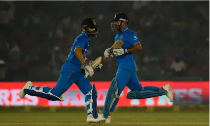  ?? AFP ?? India’s Virat Kohli and captain Mahendra Singh Dhoni run between wickets during the third ODI on Sunday. —