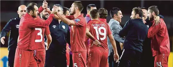  ?? EPA PIC ?? Macedonia players celebrate after a 1-1 draw against Italy in their Group G match in Turin on Friday.